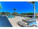 Backyard oasis featuring a sparkling pool, waterfront views, and comfortable lounge area for ultimate relaxation at 1918 Massachusetts Ave, Englewood, FL 34224