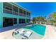 Beautiful backyard with a refreshing pool and inviting lounge chairs at 1918 Massachusetts Ave, Englewood, FL 34224