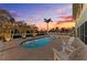 Beautiful pool area with in-pool loungers and comfortable seating, surrounded by lush landscaping at 1918 Massachusetts Ave, Englewood, FL 34224