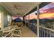 Spacious screened porch with comfortable seating and stunning waterfront views at 1918 Massachusetts Ave, Englewood, FL 34224