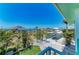 Breathtaking view of the canal from the balcony showcasing lush landscaping, private boat docks, and clear blue water at 1918 Massachusetts Ave, Englewood, FL 34224