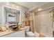 Cozy bathroom featuring shower and bath with a modern bowl sink and granite countertops at 2103 L Pavia Blvd # 2103, Venice, FL 34292