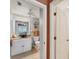 Well-lit bathroom features a bowl sink, tiled floors, and neutral paint at 2103 L Pavia Blvd # 2103, Venice, FL 34292