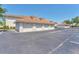 Detached condominium garages featuring red tile roofs and ample parking spaces at 2103 L Pavia Blvd # 2103, Venice, FL 34292