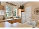 Bright kitchen area with lots of counter space, white appliances and a sink at 2103 L Pavia Blvd # 2103, Venice, FL 34292