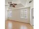 Serene main bedroom with tray ceiling, natural light, and a glimpse into the en-suite bathroom at 2103 L Pavia Blvd # 2103, Venice, FL 34292