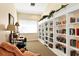Bright office space featuring large bookshelves, a comfy chair and ample natural light at 2103 L Pavia Blvd # 2103, Venice, FL 34292