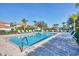 Sparkling pool surrounded by comfortable lounge chairs and lush landscaping at 2103 L Pavia Blvd # 2103, Venice, FL 34292