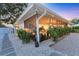 A cozy sunroom extends onto a landscaped patio, offering seamless indoor-outdoor living and entertaining at 2111 Ivory Pl, Sarasota, FL 34239