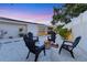 Backyard fire pit area with seating, 'S'mores Station', and surfboards mounted on the house at 2111 Ivory Pl, Sarasota, FL 34239