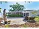 Inviting backyard with a paved patio and a screened-in porch, perfect for outdoor living at 2111 Ivory Pl, Sarasota, FL 34239