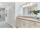 Elegant bathroom with marble countertops, white cabinetry, and a glass-enclosed shower at 2111 Ivory Pl, Sarasota, FL 34239
