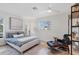Bright bedroom with a comfortable bed, modern fan, and stylish decor at 2111 Ivory Pl, Sarasota, FL 34239