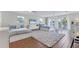 Bright bedroom featuring 2 beds, a large area rug and multiple windows at 2111 Ivory Pl, Sarasota, FL 34239