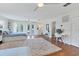 Bright bedroom featuring bed, french doors and a desk area at 2111 Ivory Pl, Sarasota, FL 34239
