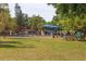 A public fitness park on a grass field, equipped with different fitness equipment and facilities at 2111 Ivory Pl, Sarasota, FL 34239