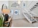 Welcoming foyer with staircase, front door, and natural light at 2111 Ivory Pl, Sarasota, FL 34239