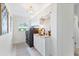Well-organized laundry room with modern appliances, cabinets, and a sink at 2111 Ivory Pl, Sarasota, FL 34239