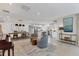 Open concept living space featuring tile floors, dining area, living room and kitchen with an island at 2111 Ivory Pl, Sarasota, FL 34239