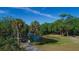 Beautiful park scene with walking paths, a pond with a fountain, and lush trees at 2111 Ivory Pl, Sarasota, FL 34239