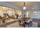 Covered patio with an outdoor dining area and seamless transition to the interior living space at 2111 Ivory Pl, Sarasota, FL 34239