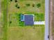 Aerial view of a property highlighting the landscaping and outdoor pool, and its position in the community at 217 Rotonda S Blvd, Rotonda West, FL 33947