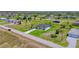 Expansive aerial view of a modern home with a driveway and landscaped yard, nestled in a quiet neighborhood at 217 Rotonda S Blvd, Rotonda West, FL 33947