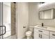 Modern bathroom features sleek vanity, mirror, and a glass-enclosed shower at 217 Rotonda S Blvd, Rotonda West, FL 33947