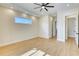 Bright bedroom with hardwood floors, ceiling fan and natural light from horizontal window at 217 Rotonda S Blvd, Rotonda West, FL 33947