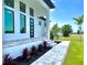 Modern front entrance with a stylish walkway and vibrant plants at 217 Rotonda S Blvd, Rotonda West, FL 33947