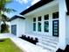 Welcoming front entrance with a decorative walkway and manicured landscaping at 217 Rotonda S Blvd, Rotonda West, FL 33947