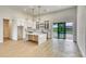 Bright kitchen features white cabinets, stainless steel appliances, and central island at 217 Rotonda S Blvd, Rotonda West, FL 33947