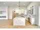A modern kitchen and living room with a view to the fireplace at 217 Rotonda S Blvd, Rotonda West, FL 33947