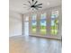 Bright, naturally lit living room with large windows offering lush outdoor views at 217 Rotonda S Blvd, Rotonda West, FL 33947