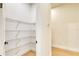 Walk-in pantry with wire shelving and wood-look floors at 217 Rotonda S Blvd, Rotonda West, FL 33947