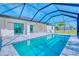 Inviting pool area with screened-in enclosure and ample space for outdoor entertaining at 217 Rotonda S Blvd, Rotonda West, FL 33947