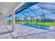 Relaxing pool area with screened enclosure and beautiful views of the surrounding landscape at 217 Rotonda S Blvd, Rotonda West, FL 33947