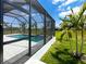 Screened-in pool area with clean, modern lines and sunny backyard at 217 Rotonda S Blvd, Rotonda West, FL 33947