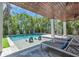 Beautiful backyard featuring a pool, spa, and lounge chairs at 222 Willow Ave, Anna Maria, FL 34216