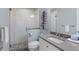 Bright bathroom with white cabinets, a modern vanity, and frameless shower at 222 Willow Ave, Anna Maria, FL 34216