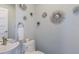 Well-decorated half bathroom with modern faucet and stylish wall art at 222 Willow Ave, Anna Maria, FL 34216