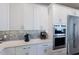 Kitchen details include modern stainless appliances and white countertop at 222 Willow Ave, Anna Maria, FL 34216