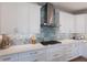 Kitchen details include modern stainless range hood and backsplash at 222 Willow Ave, Anna Maria, FL 34216