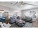 Open-concept living room boasts hardwood floors, comfortable seating, and seamless flow to other areas at 222 Willow Ave, Anna Maria, FL 34216