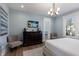 Cozy bedroom featuring a dark wooden dresser and decor for a relaxing and comfortable ambiance at 222 Willow Ave, Anna Maria, FL 34216