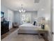 Serene bedroom with soft color palette, complemented by natural light streaming through shuttered windows at 222 Willow Ave, Anna Maria, FL 34216