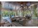 Luxury outdoor space with pool, lounge, and fully equipped dining area at 222 Willow Ave, Anna Maria, FL 34216