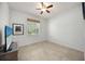 Neutral bedroom featuring tile flooring, a window and a TV on a dresser at 2239 Ellarose Cir, Sarasota, FL 34232