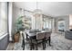 Cozy dining area with a dark wood table, comfortable chairs, and a view of the outdoors at 2239 Ellarose Cir, Sarasota, FL 34232