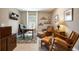 Traditional home office with leather furniture, wood desk, and tile flooring at 2239 Ellarose Cir, Sarasota, FL 34232